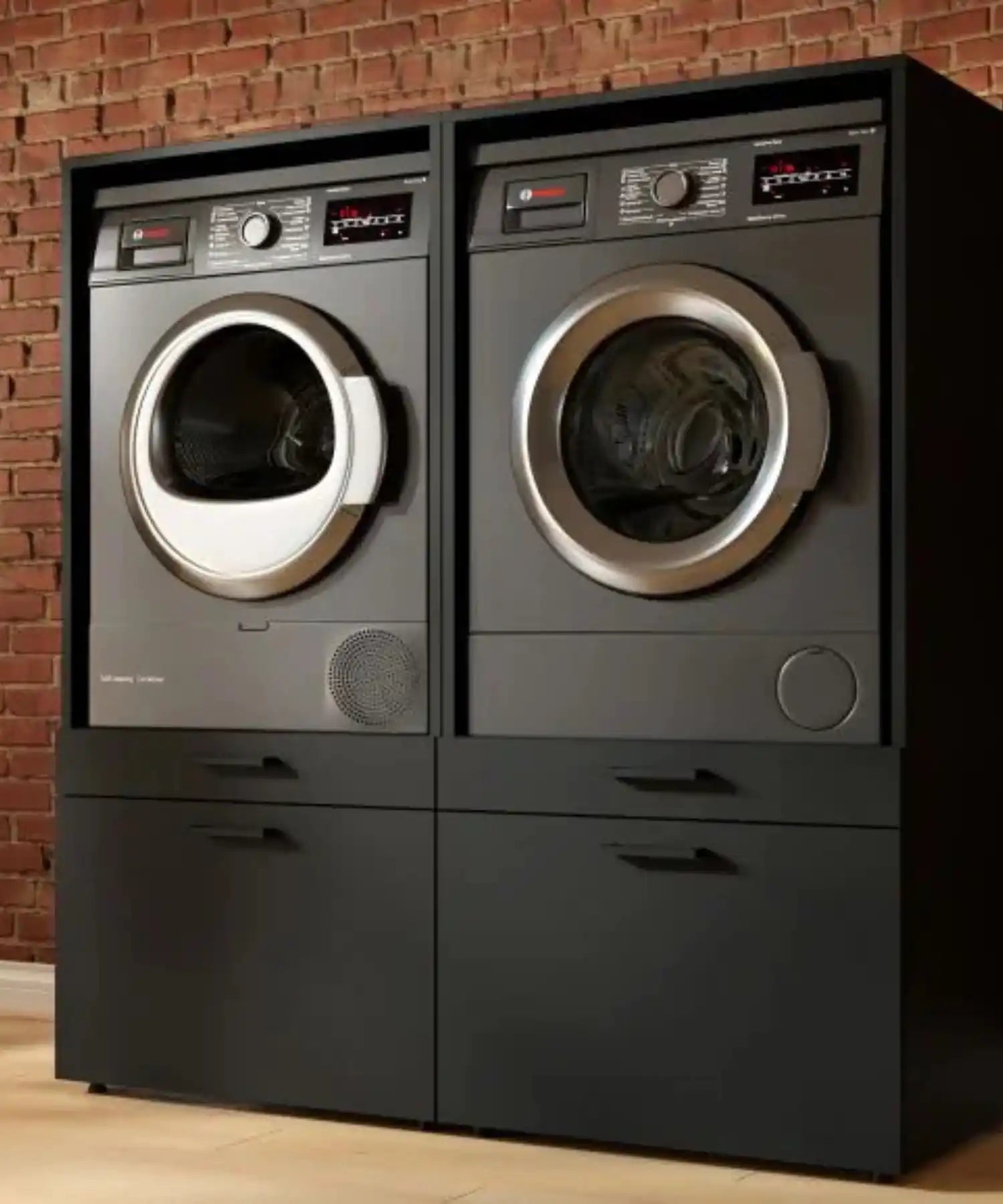 Gestapelde zwarte wasmachine en droger.